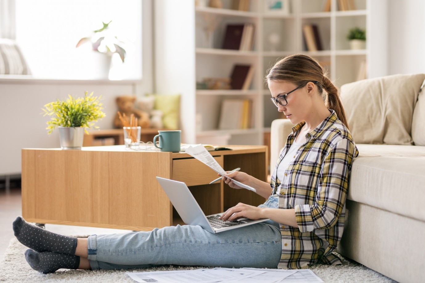 Woman researching franchise opportunities on a laptop at home