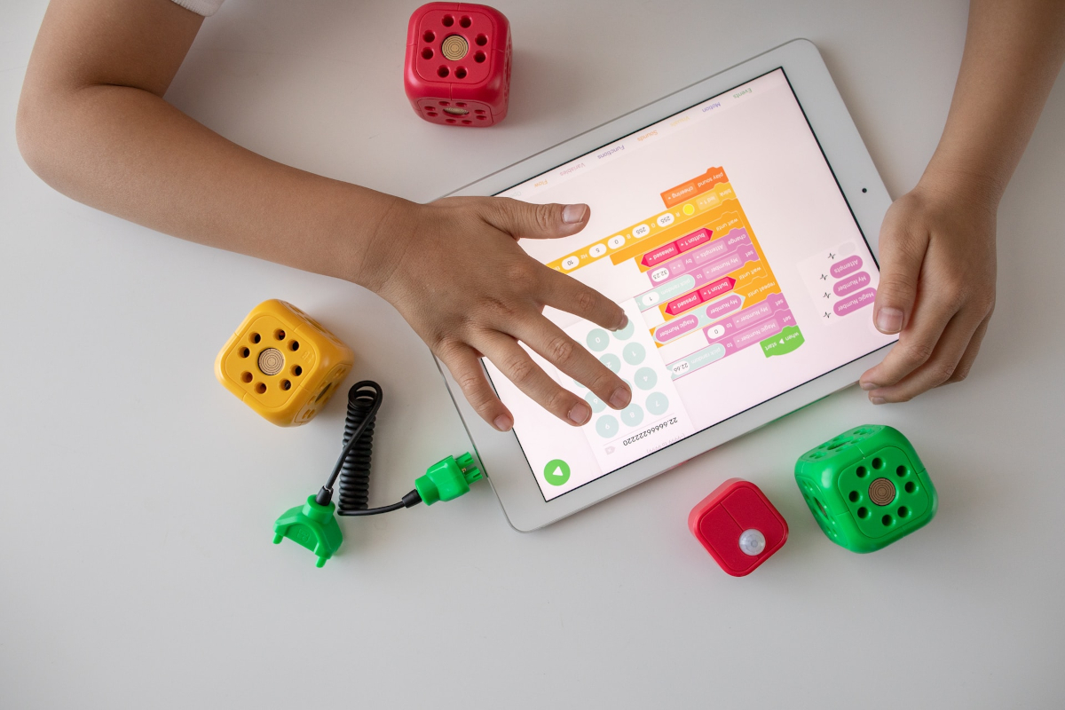 Child playing an educational game on an iPad 
