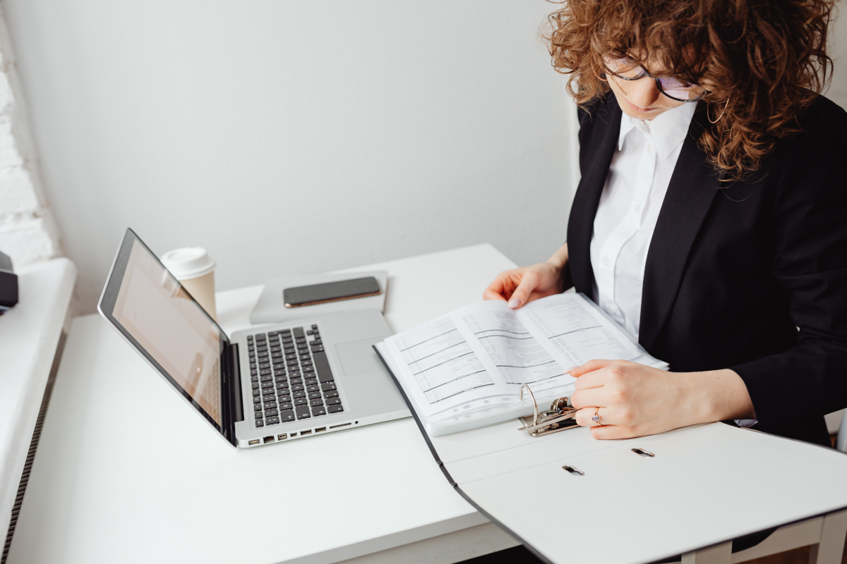 A business women looking at financial documents
