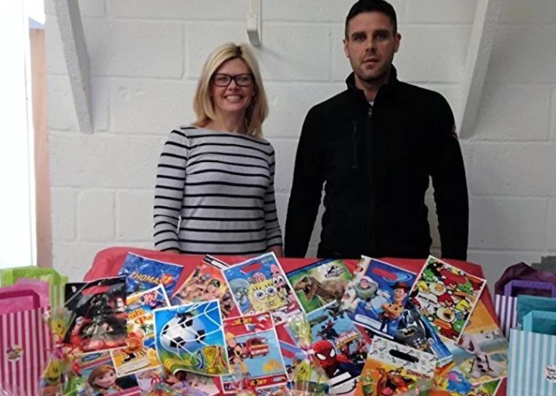 man and woman with party bags