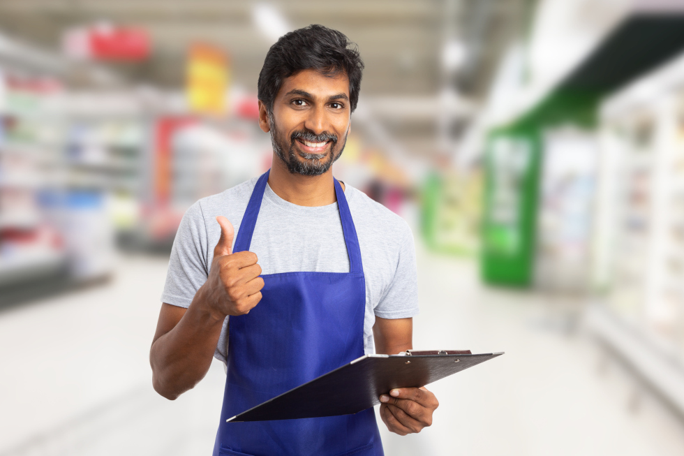 smiling man with clipboard