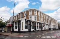 prominent pub by stadium - 1