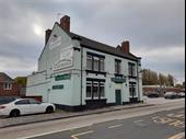 busy pub with building